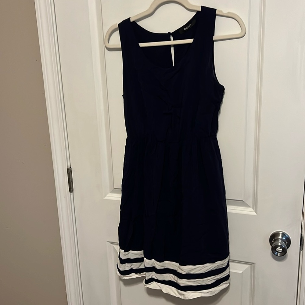 Navy blue dress with white stripes at the bottom